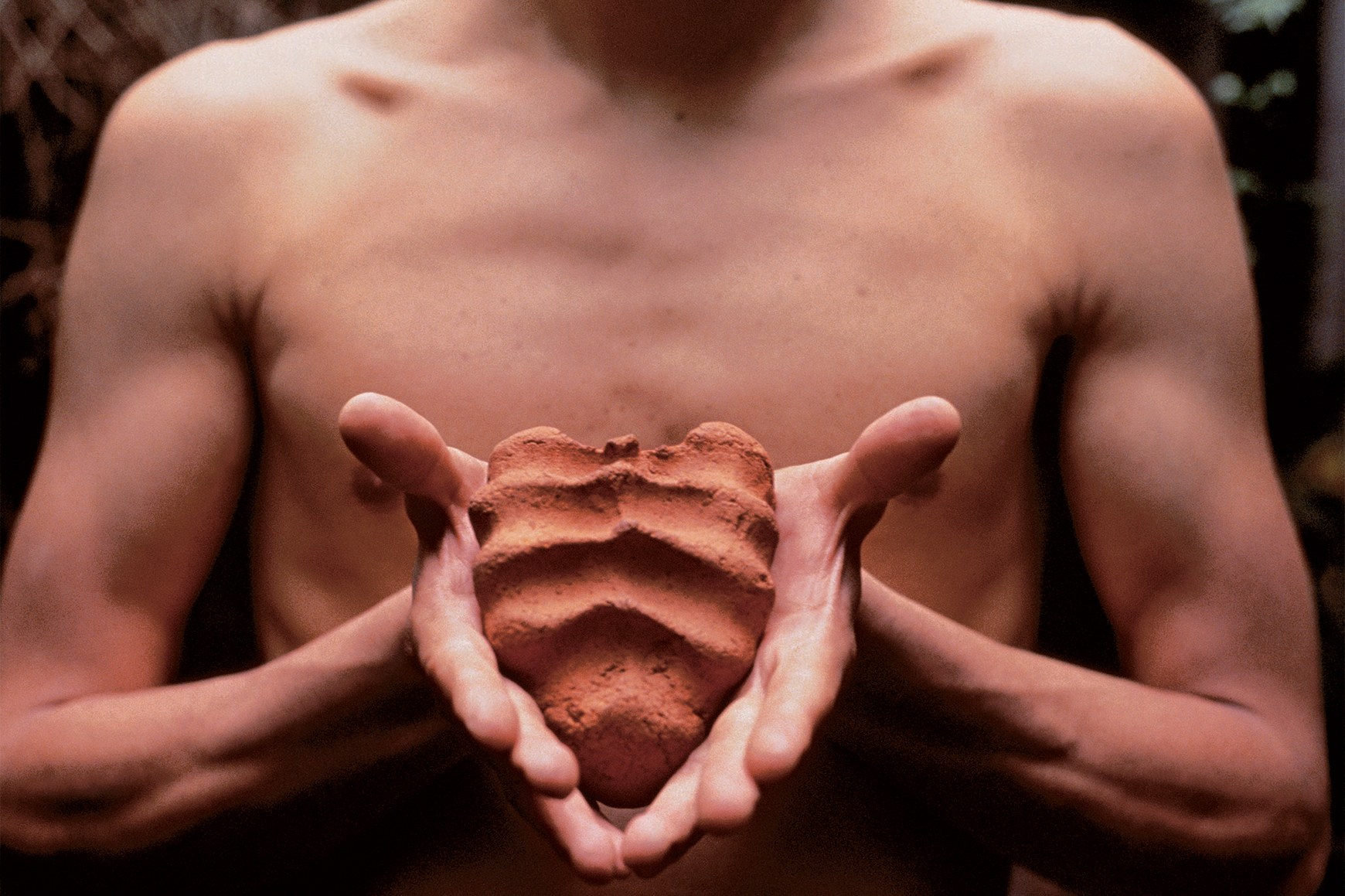 Gabriel Orozco, Mis manos son mi corazón (My Hands Are My Heart), 1991, diptych, two Cibachrome prints, each 9 1⁄8 × 12 1⁄4". A shirtless figure holds a clay object in both hands, first tightly clasped, then displayed openly, revealing its heart-like shape and textured surface.