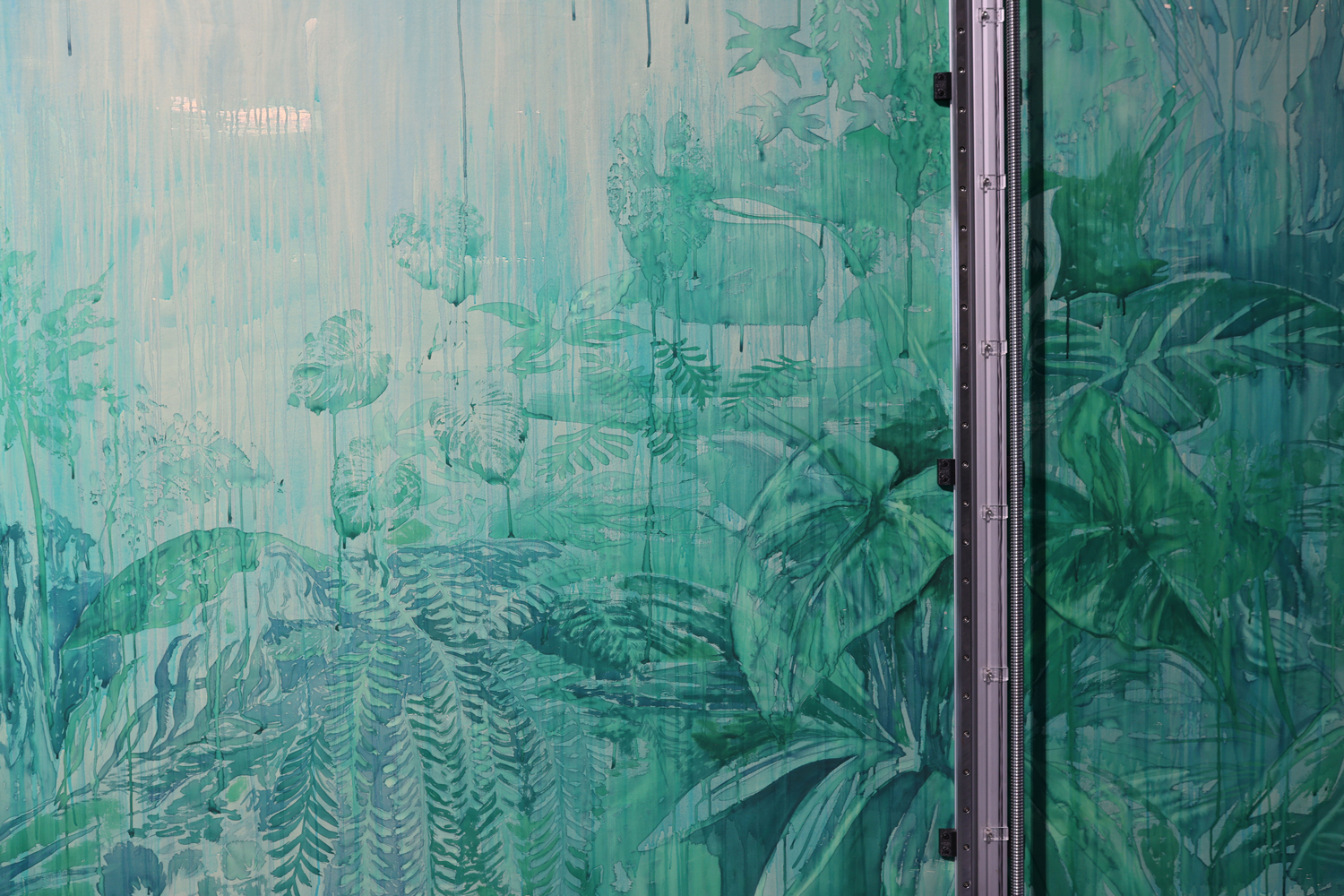 A painted green and blue wall with dripping effects, depicting tropical plants and foliage, intersected by a metal structural frame on the right.
