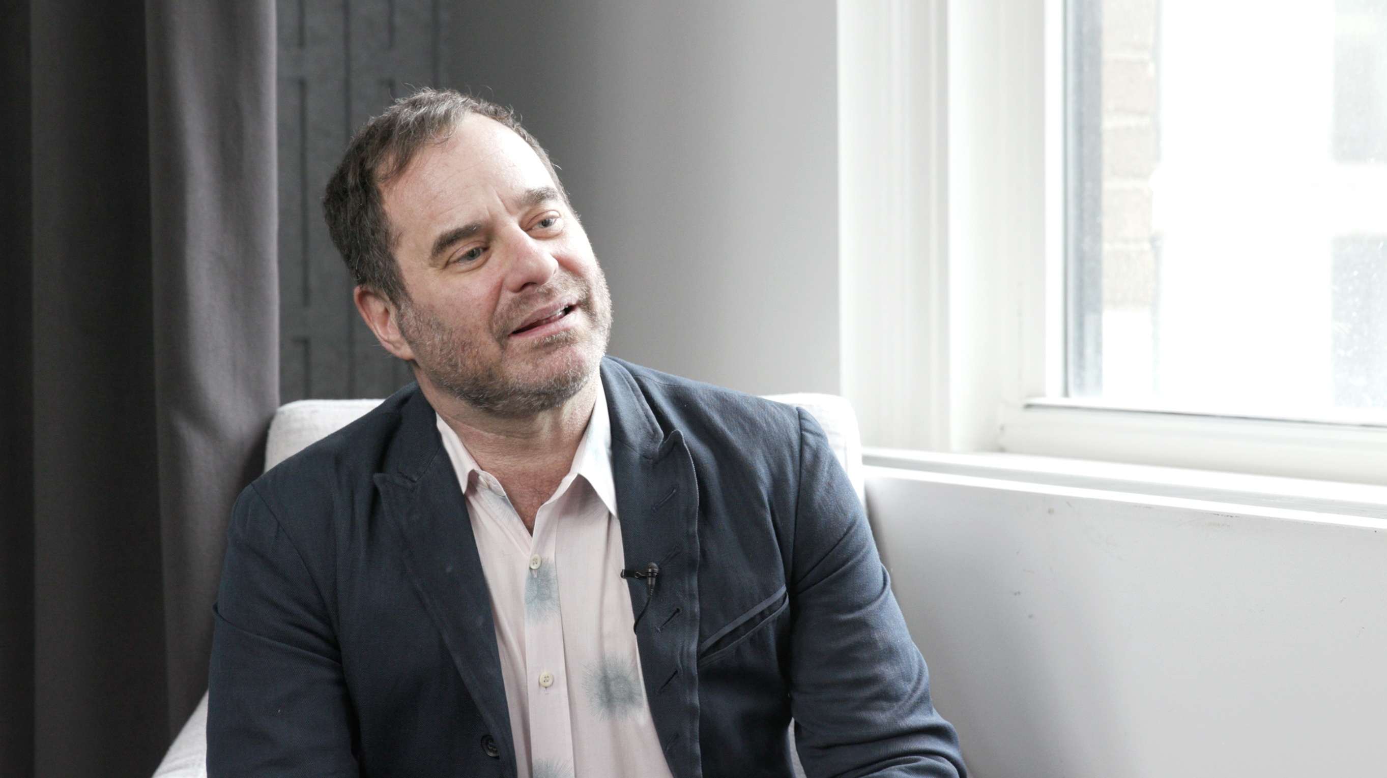 Richard Meyer sitting in Artforum's studio for the February 2025 episode of "Under the Cover".